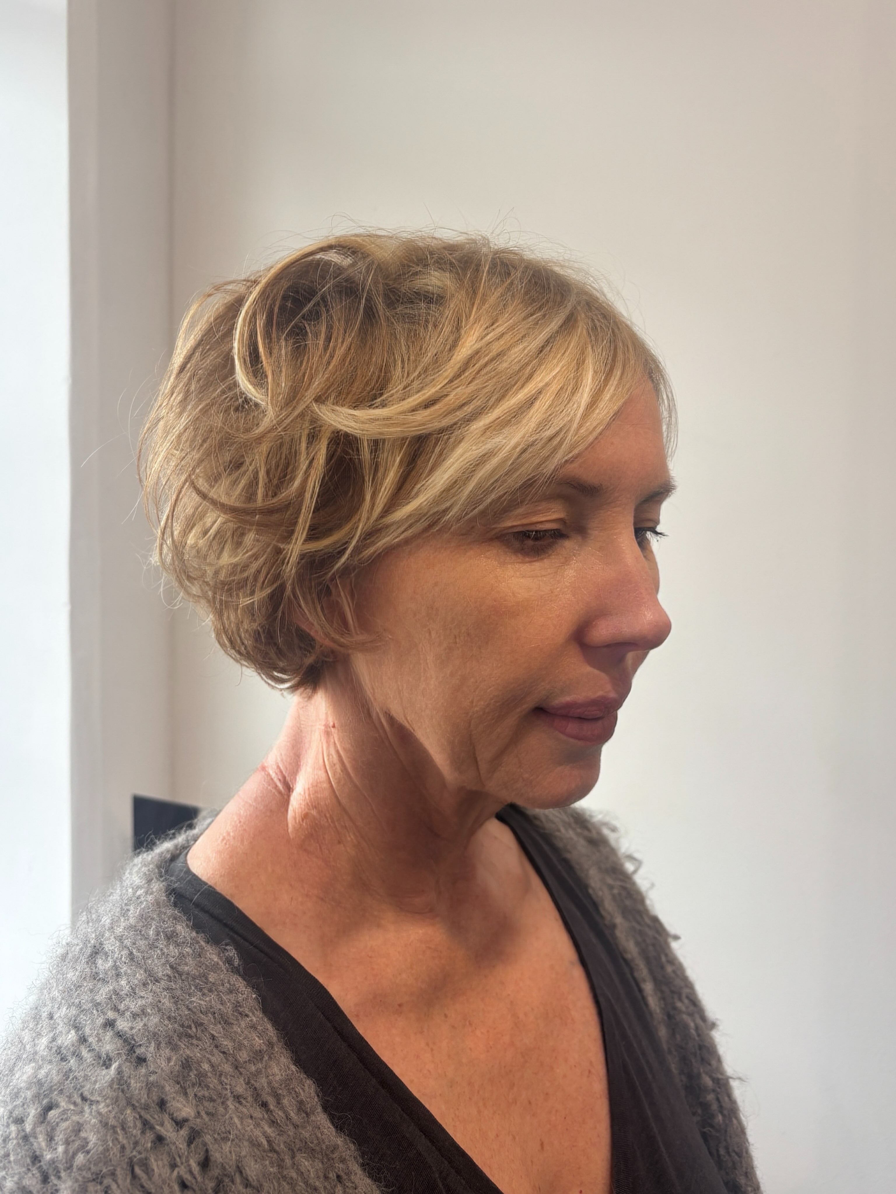 Mature client with a softly textured short blonde haircut